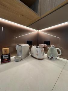 a group of appliances sitting on a counter in a room at Villa Luxury Jevarò - Peschiera del Garda in Peschiera del Garda