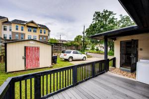 a white car parked on a deck with a house at Walkable to FSU Campus Cozy Retreat with Deck! in Tallahassee