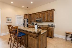 a kitchen with wooden cabinets and a counter top at Sea Point #304 in Saint Simons Island