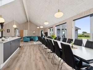 a conference room with a long table and chairs at 5 star holiday home in Spøttrup in Spottrup