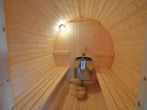 an inside of a wooden sauna with a sink at Trooz Villa with Pool & Sauna in Trooz