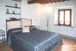 A bed or beds in a room at La terrazza di Susanna