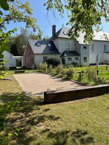 a house with a large yard with a driveway at House in a residence with swimming pool near Le Touquet Paris Plage in Saint-Josse