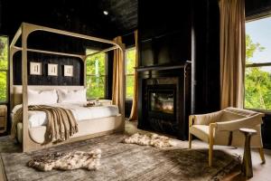 a bedroom with a bed and a fireplace at Midnight Mountain in Sevierville