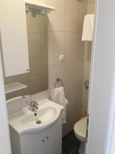 a bathroom with a sink and a toilet at Apartments Villa Jennifer in Orebić +34 photos