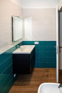 a bathroom with a sink and a mirror at Starry Sky House in Mola di Bari +14 photos