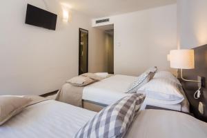 Postel nebo postele na pokoji v ubytování Villas Arausana & Antonina