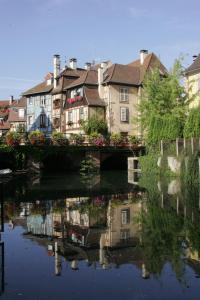 a large body of water surrounded by houses at Reflets Sur La Lauch appartements in Colmar