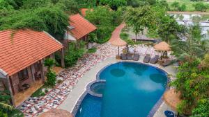 an overhead view of a swimming pool at a resort at Chinh Thu Garden Retreat in Ninh Binh