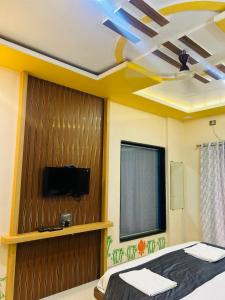 Μια τηλεόραση ή/και κέντρο ψυχαγωγίας στο Hotel Strawberry homes, stay