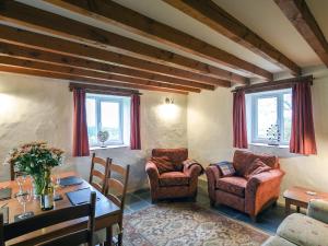 Posezení v ubytování Heron Cottage