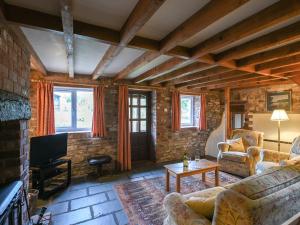 Posezení v ubytování Heron Cottage