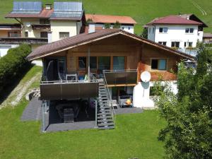 a house with a staircase leading to a balcony at Apartment Jenewein by Interhome in Obernberg am Brenner