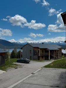 a car parked in front of a house with mountains at Yci 66, séjour 4 pers aux Angles in Les Angles +19 photos