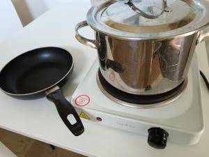a pot and spatula sitting on top of a blender at Huilikammari in Seinäjoki