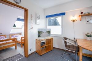 Giường trong phòng chung tại HER14b Ferienwohnung Hartig +5 ảnh