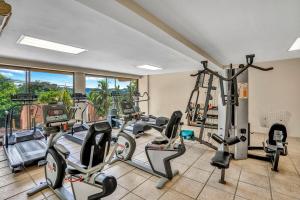 a gym with several treadmills and elliptical machines at Presidential Suites 4 - Spacious condo in the heart of Flamingo, sleeps 6 in Playa Flamingo