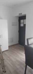 an empty office with a black door and a chair at El Rincón de Perez A in Ajo +17 photos