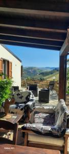 a patio with couches and a table and a large window at Al ficodindia in Scopello +75 photos