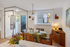 a kitchen and dining room with a table and chairs at Ferienwohnung Lilly in Hofgeismar