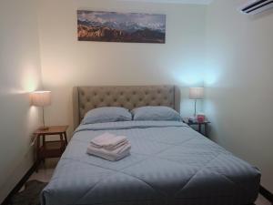Giường trong phòng chung tại Anna Residence