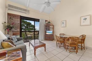 a living room with a couch and a table at Maui Vista 2422 in Kihei