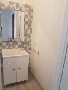 a bathroom with a sink and a mirror at CasaLisetta in Serracapriola