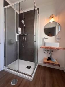 a shower stall with a glass door in a bathroom at Fishermans House in Almograve +44 photos