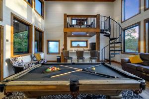 a room with a pool table in a house at The Heights - Luxury Cabin with Mountain Views & Hot Tub in Stephens Gap