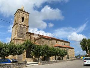 an old stone building with a tower and a church at El Rincón de Perez B in Ajo