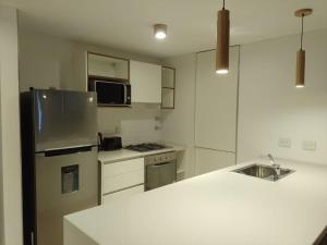 Dapur atau dapur kecil di Dpto Jacaranda 1