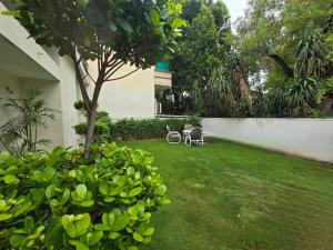 a garden with a bike parked next to a wall at Bridge Residency-1 F6 Islamabad in Islamabad