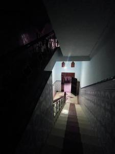 a dark room with a staircase and a stair case at Maison de vacances in Nador