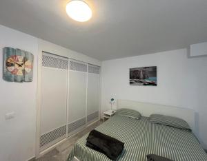 Ένα ή περισσότερα κρεβάτια σε δωμάτιο στο Dinastia1RbHa +41 φωτογραφίες