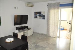 TV a/nebo společenská místnost v ubytování Dinastia1RbHa
