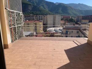 a balcony with a view of a city and mountains at Brain Penthouse Pagani in Pagani