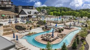 an outdoor water park with a water slide at Smith Creek Resort - 5 Bedrooms 20 Guest - Indoor Pool - Resort Amenities in Pigeon Forge