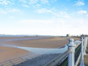 a view of the beach from a fence at Sand Dune - Uk48699 in Lancaster