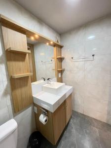 a bathroom with a sink and a toilet at Casa em Penha- SC in Penha