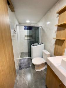 a bathroom with a toilet and a shower at Casa em Penha- SC in Penha