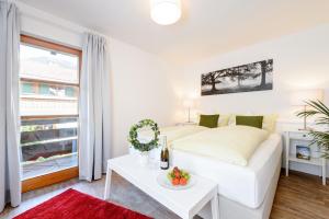 Postel nebo postele na pokoji v ubytování "Ferienwohnung Ess" - Annehmlichkeiten von 4-Sterne Familien-und Wellnesshotel Viktoria können mitbenutzt werden