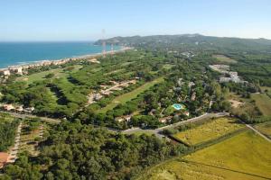 an aerial view of a park with the ocean and a city at Apart-Hotel Golf Beach 35201 in Sa-Riera