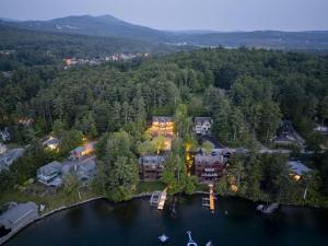 an aerial view of a home on a lake at Peekaboo Lake View Luxury 5BR with Game Room in Gilford