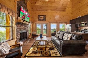 a living room with a couch and a fireplace at Heavenly Haven by American Patriot Getaways in Cartertown