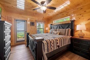 a bedroom with a bed and a ceiling fan at Heavenly Haven by American Patriot Getaways in Cartertown +28 photos