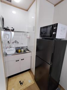 Η κουζίνα ή μικρή κουζίνα στο Marbury Heights Kotsutsu - Vacation STAY 92150v