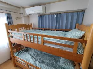 Ένα ή περισσότερα κρεβάτια σε δωμάτιο στο Marbury Heights Kotsutsu - Vacation STAY 92150v