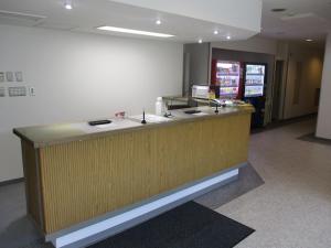 an office lobby with a reception desk and a counter at Hotel Tetora Honhachinohe - Vacation STAY 85503v in Hachinohe