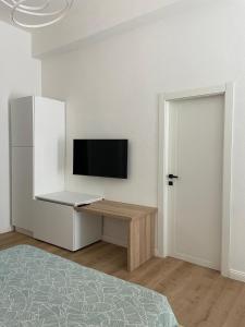 TV a/nebo společenská místnost v ubytování Casa vacanze La Casa di Leo