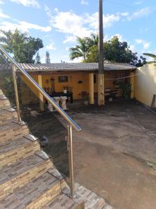 a house with a staircase in front of it at Chácara Duquinha 3 in Triunfo